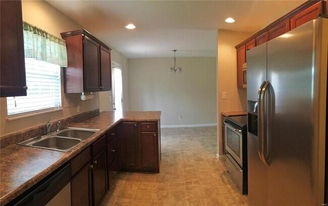 Kitchen into the dinning room - 1310 Villa Verde Ct