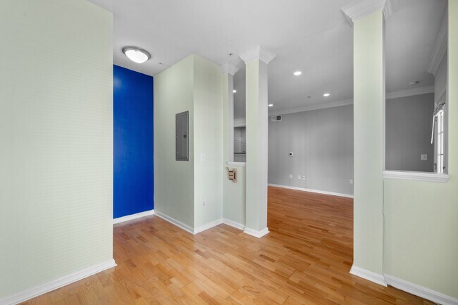 Building Photo - Two-bedroom, two-bathroom model with a den, located on the third floor.