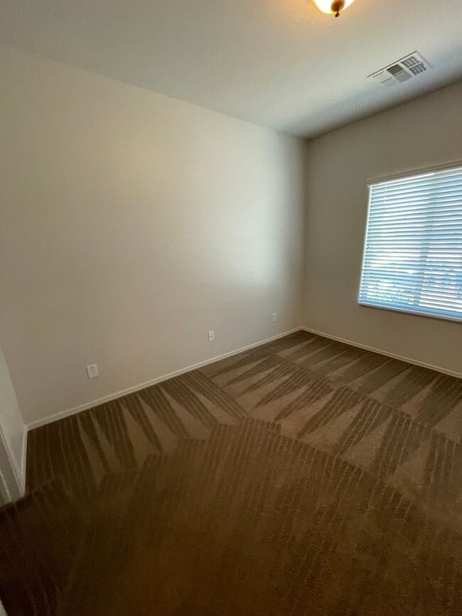 Building Photo - COMING SOON! Fireside at Norterra Spacious...