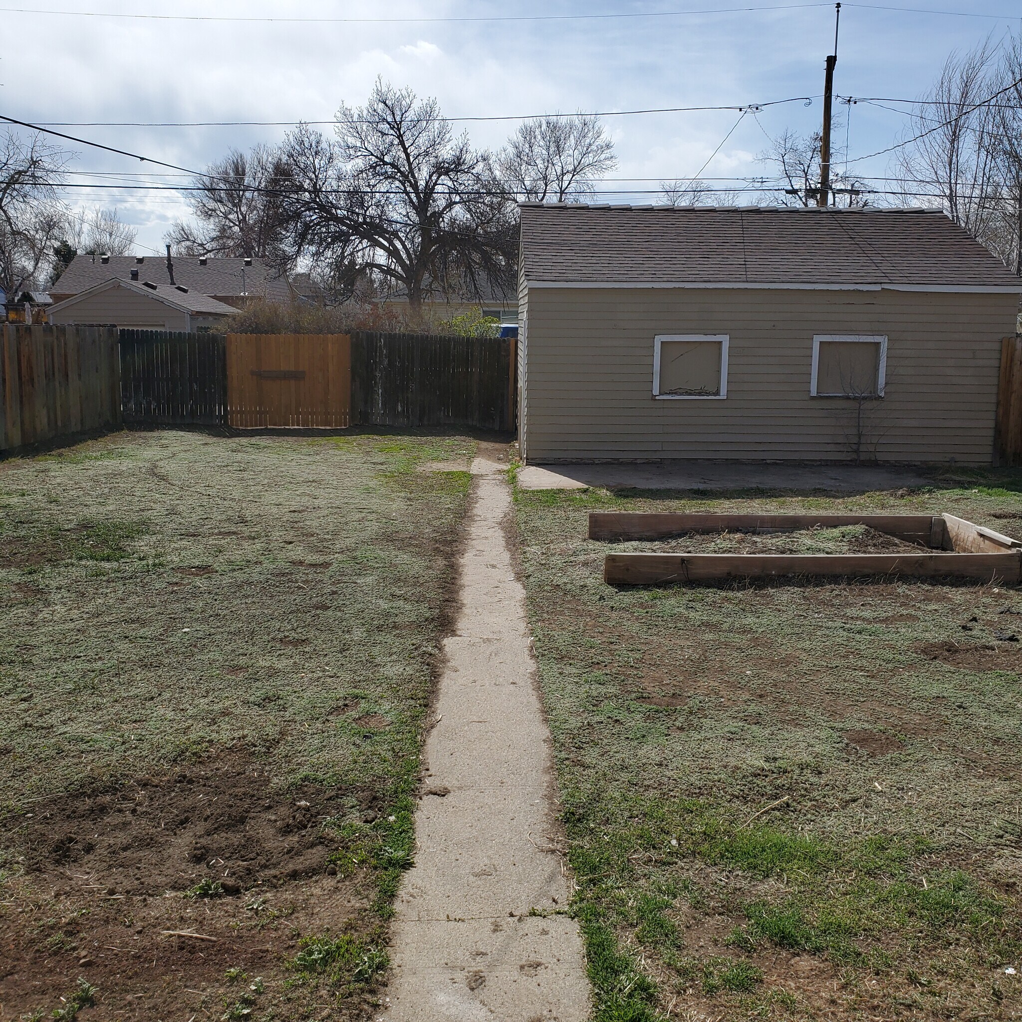 Large, fully-fenced backyard, with 2 car garage. - 1917 Joliet St