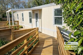 Building Photo - No rent until April 1st!! Simple Life, Serene Setting ~ Cozy 3/1.5 Available!