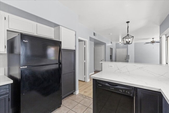 Building Photo - Sleek 2 Bedroom Condo with 2 Car Garage Ne...