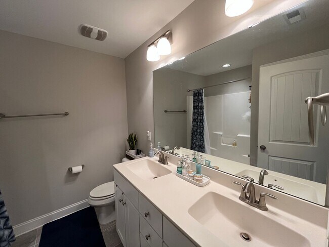 Building Photo - Exceptional 4BD, 2.5BA Cary Townhome with 2-Car Garage, Bonus 2nd Floor Living Space, and Private...