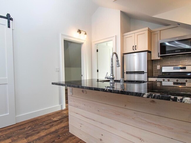 Building Photo - Expansive Loft-Style Carriage House in Private Haller Lake Estate