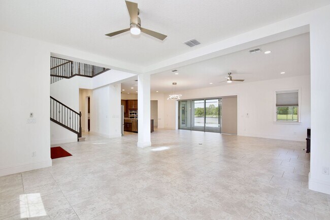 Building Photo - Stunning 4/5 Executive Pool Home in the Guard-Gated Golf Course Community of Eagle Creek - Orlando!