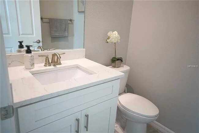Downstairs half bath - 6406 Sanctuary Creek Ln