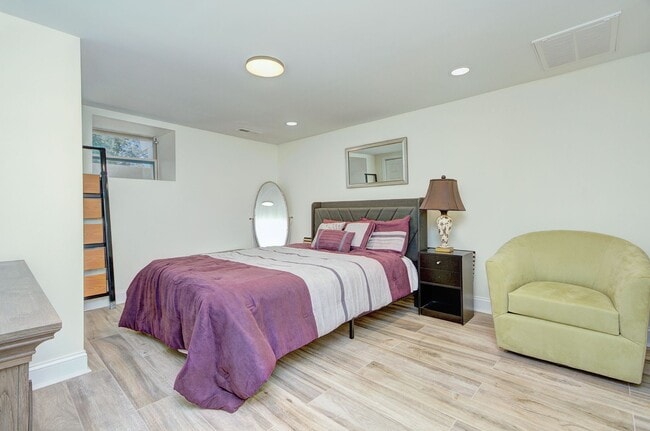 Building Photo - Discover the charm of this FULLY FURNISHED basement unit, tucked away in a beautifully updated bu...
