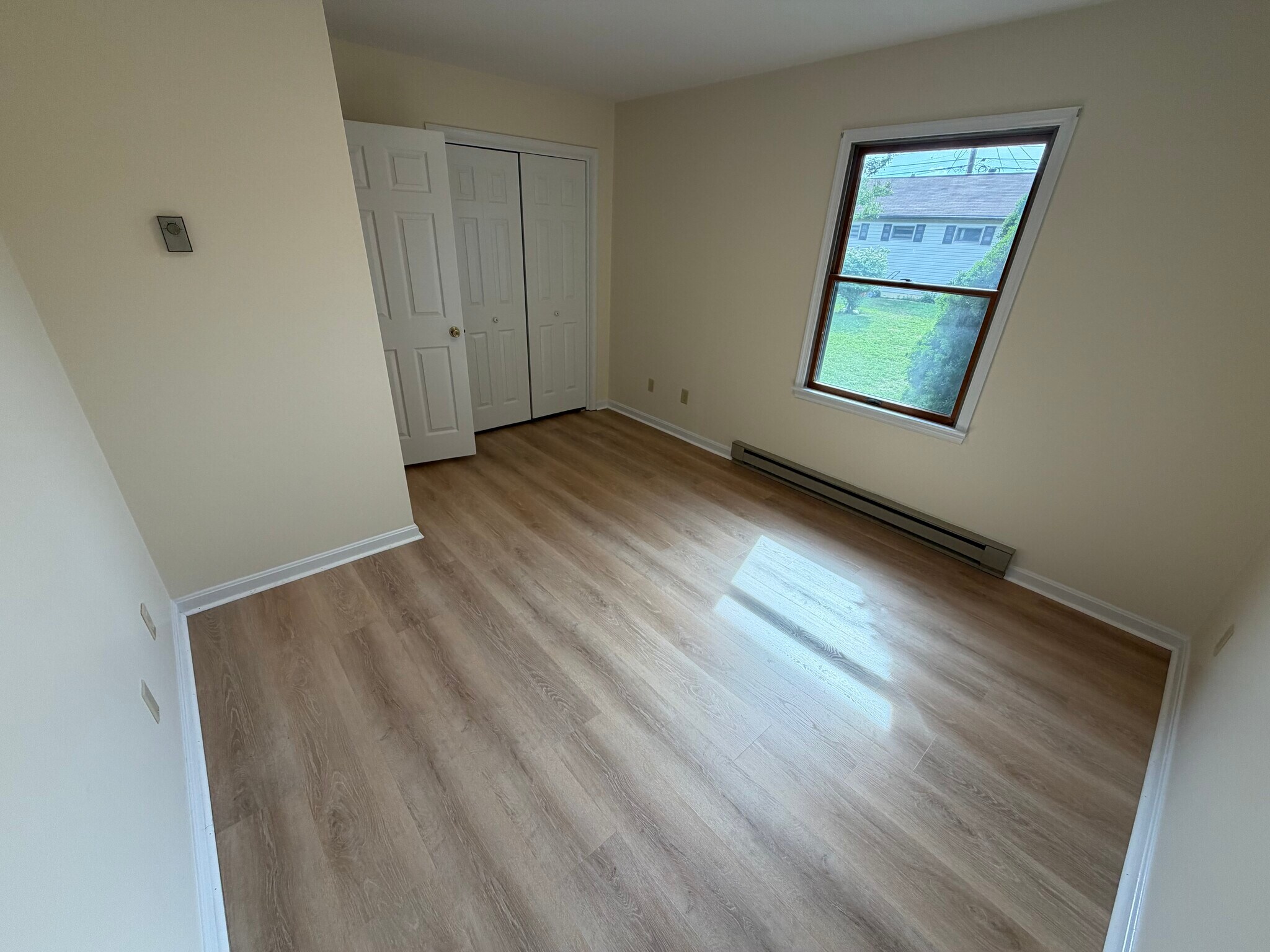 2nd bedroom- all bedrooms boast brand new luxury vinyl plank flooring - 917 Rose Hill Ave