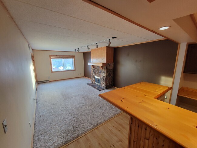 Spacious living space with good natural light that connects to a sunroom/three season porch - 3320 Louisiana Ave S