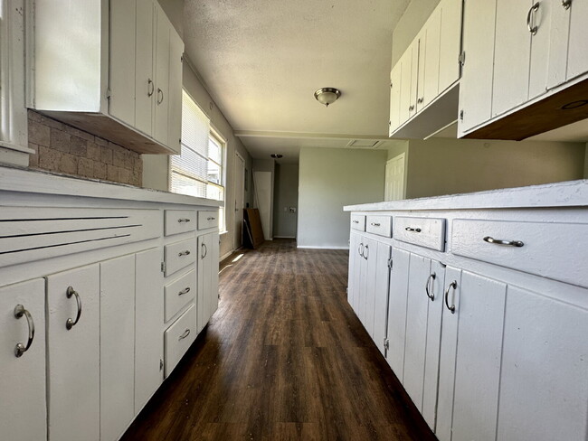 Building Photo - Updated Home with Gorgeous Floors & Large Backyard