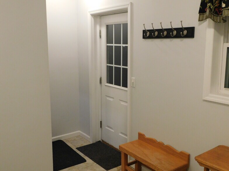 Entry Mudroom with bench & coat hooks - 26 Patricia Ln