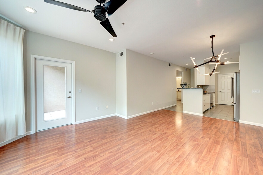 Living area with TV-wall and balcony door - 435 W Rio Salado Pky