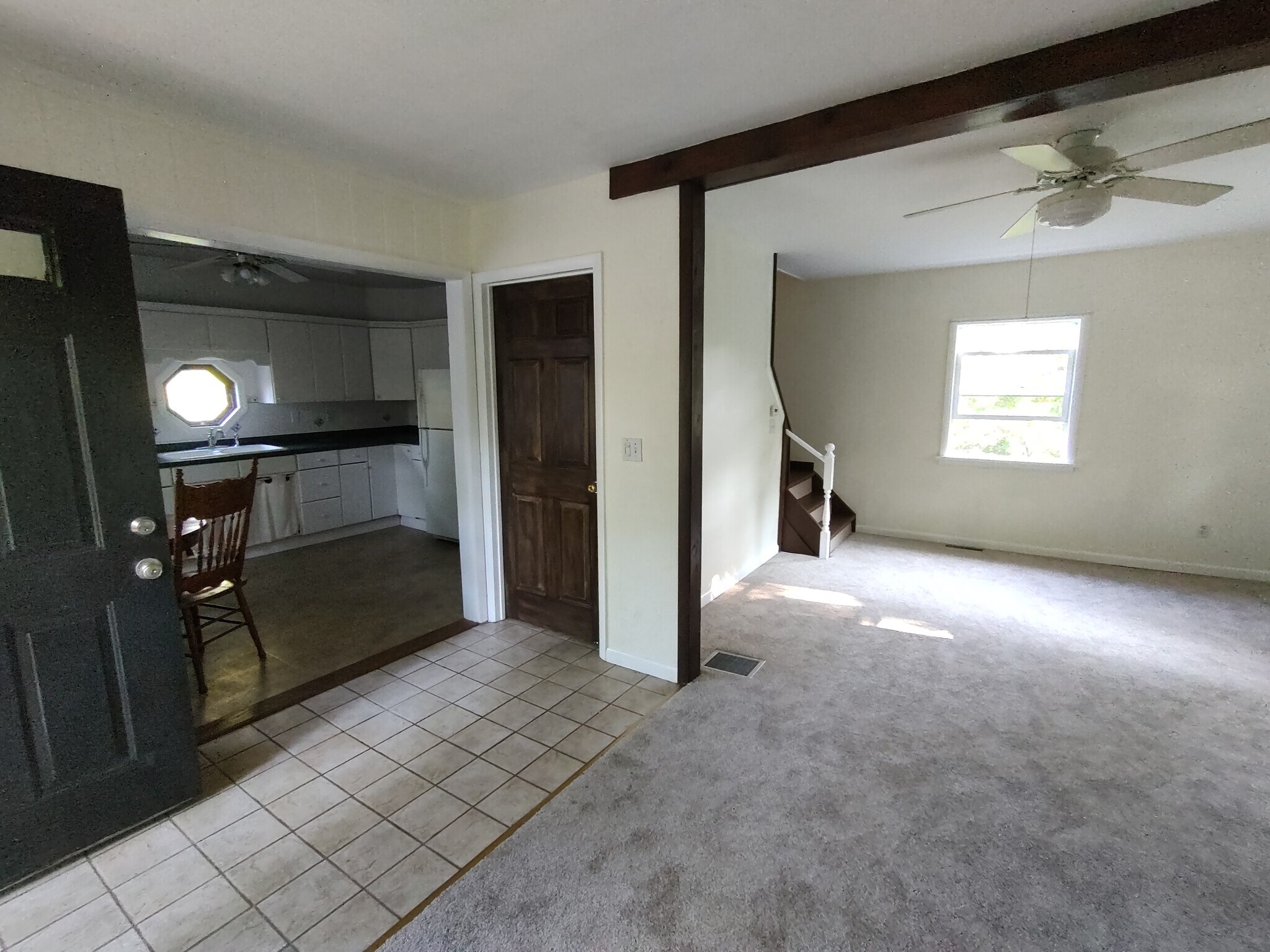 Just inside front door. Brown door is door to full basement. - 1314 Blakeley Rd