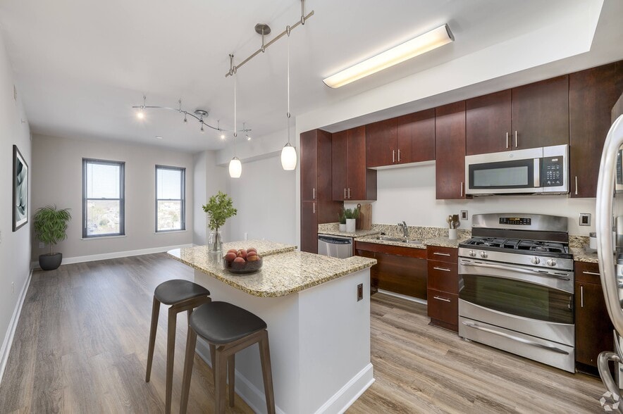 Kitchen with LTV flooring (virtually staged) - Park Place at Petworth