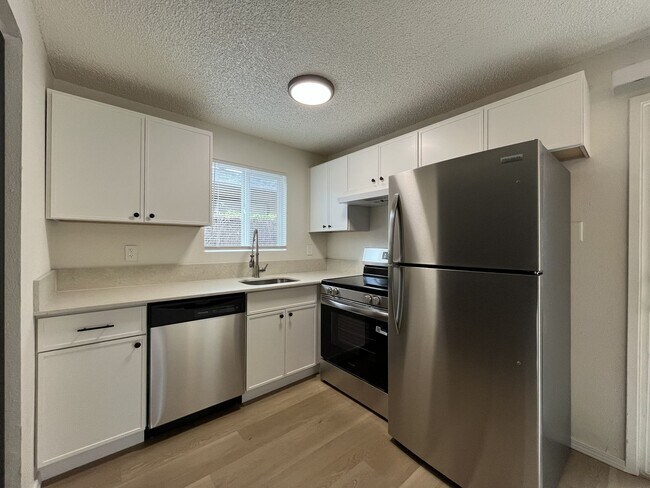 Building Photo - Inviting 2 Bedroom Home with Open Layout, Stainless Steel Appliances & Private Outdoor Retreat