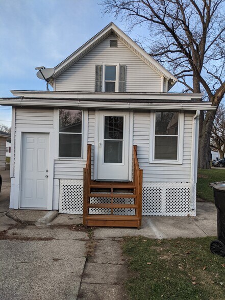 Back of Home including outside entrance to basement as well as entrance off of kitchen. - 1346 Euclid Ave