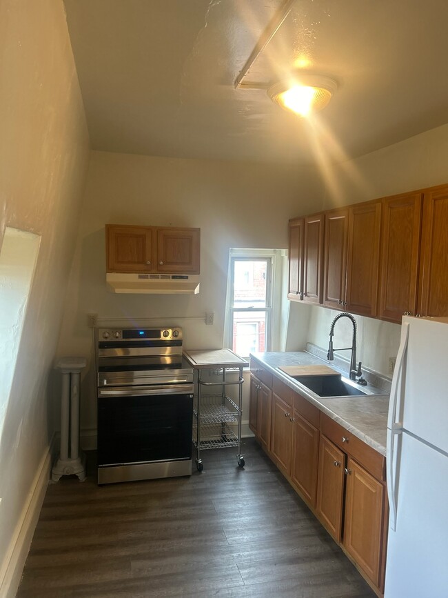 Kitchen with Refrigerator and Stove Top Range - 261 N York St