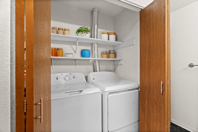 Explore this efficient laundry nook, designed for convenience. - Monte Vista Apartments
