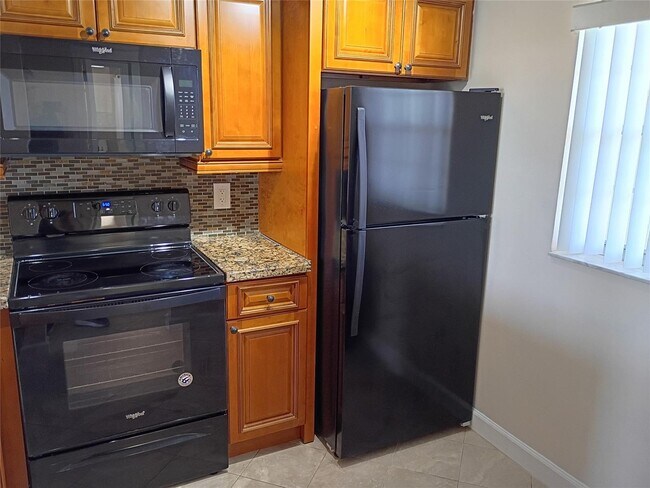 Building Photo - Stylish Remodeled Condo with Scenic Water ...