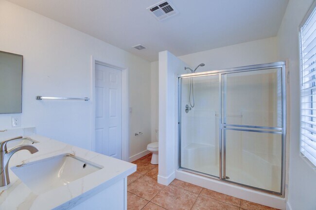 Building Photo - Great home with 4 bedrooms, 2.5 baths. New Floors Paint and Countertops.