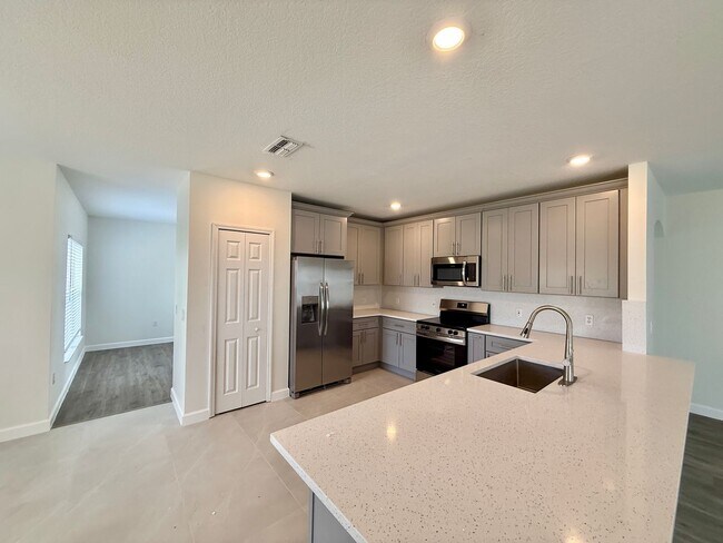 Building Photo - GORGEOUS, Large Completely Renovated Two-Story 4/2.5 PLUS LOFT in POINCIANA VILLAGES!