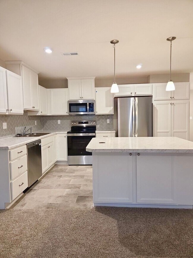 Building Photo - Exquisite just built condo with everything! Ground floor, no stairs, attached garage