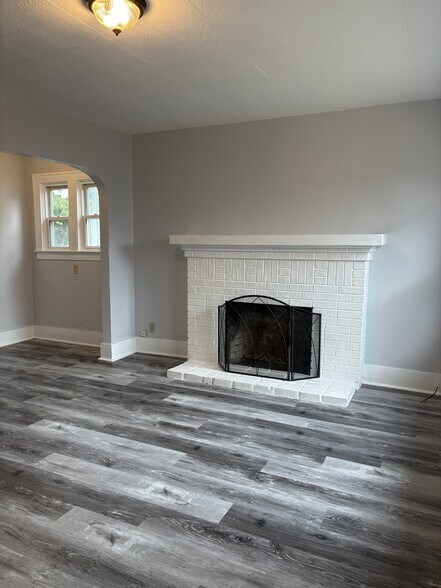 living room with wood burning fireplace - 447 16th St SE