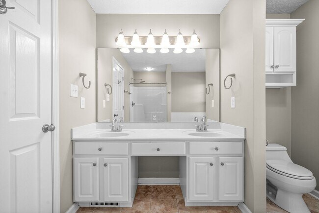 Building Photo - Pet Friendly Three Bedroom with Bonus!