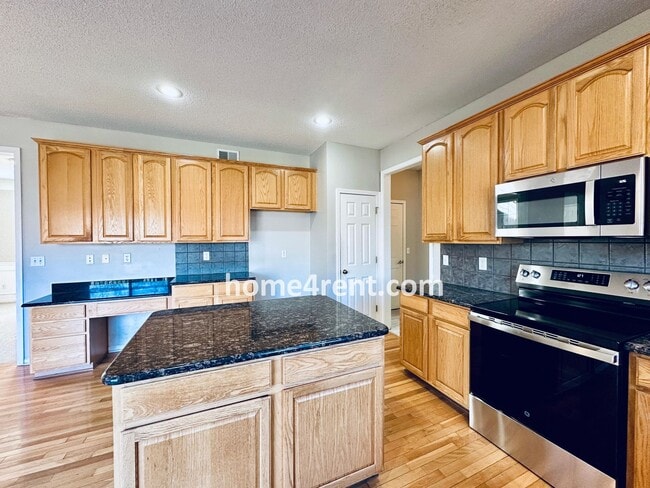 Building Photo - Gorgeous, Updated Home w/ Granite Counters and Wood Floors in Kitchen, Walkout Finished Basement!