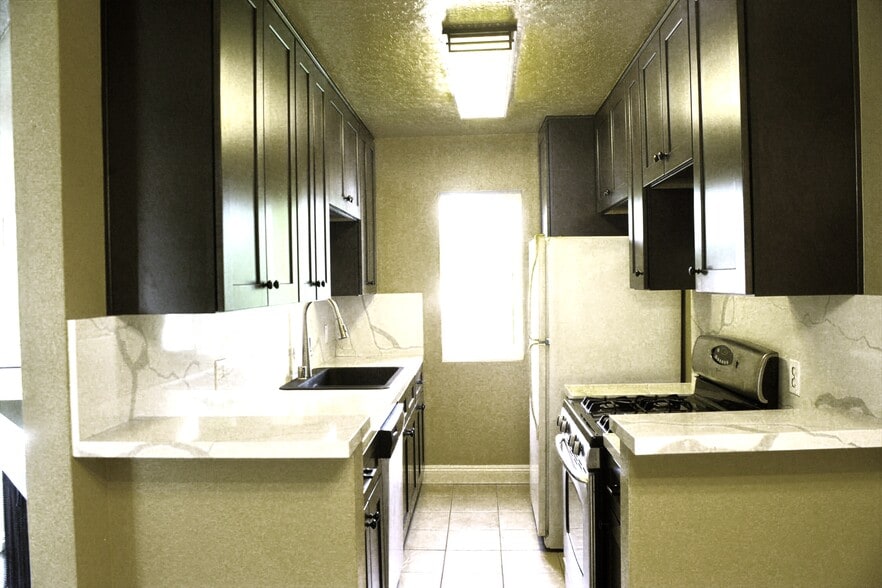 New Updated Designer Kitchen with soft close cabinet doors, Quartz Countertops and Soft light. - 4705 Kester Ave