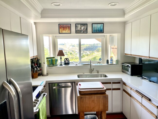 A kitchen with a beautiful view - 250 Vista Montana Way