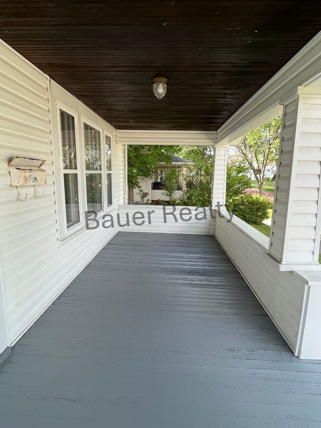 Building Photo - Three bedroom home with two car, detached garage!