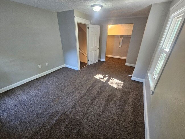 Building Photo - Spacious 4-Bedroom Cleveland Home with Updated Flooring & 2-Car Garage