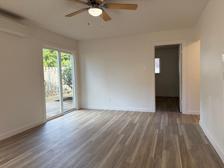 Living room with slider to fenced backyard - 2107 Y St