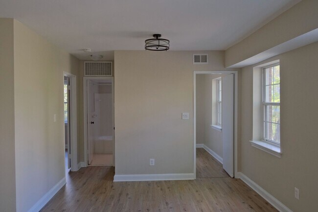 Building Photo - Beautiful corner unit in a secure, all-brick, pet-friendly building