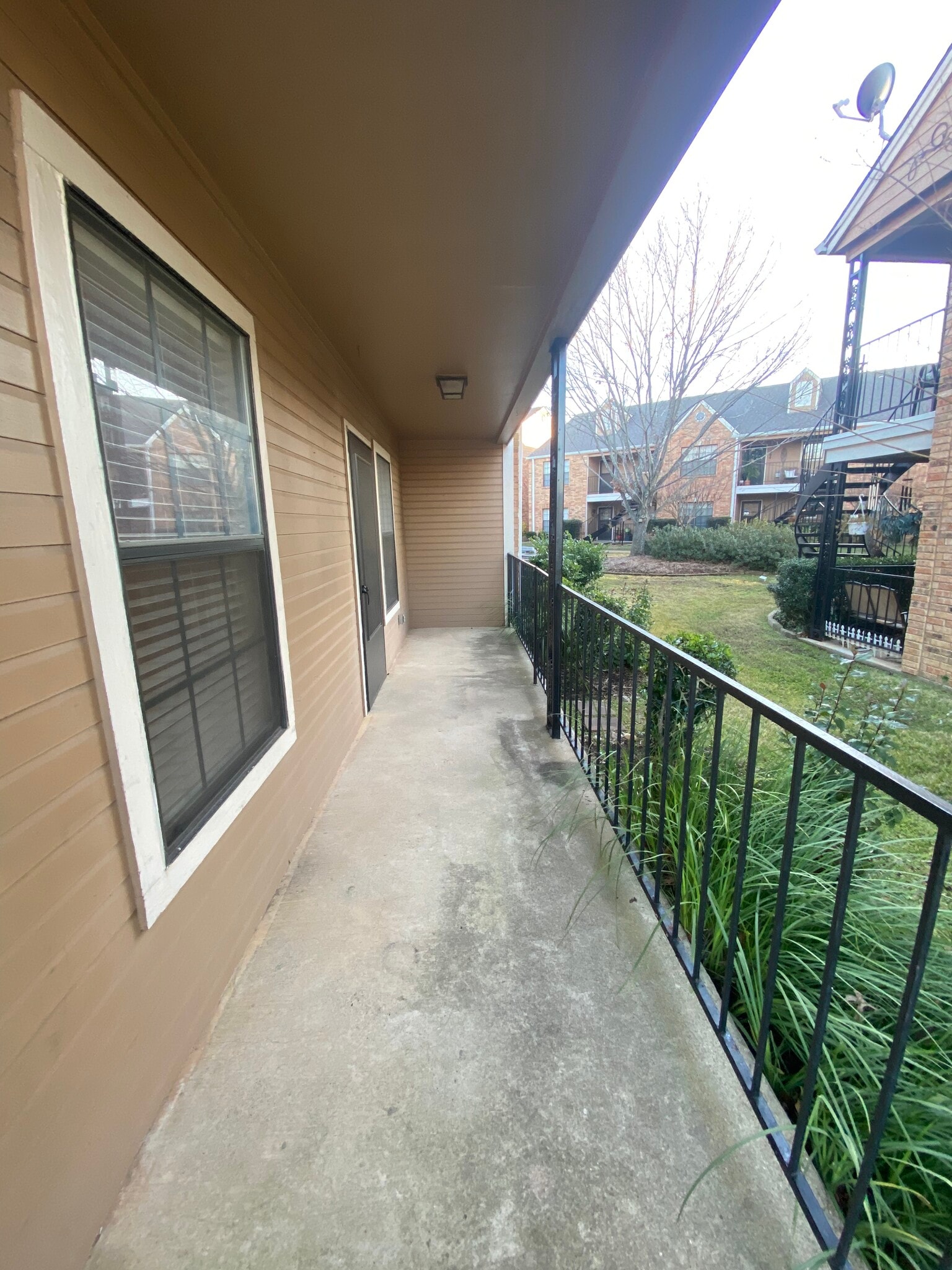 Very private back patio off the master bedroom with gate to grassy area & common shared grounds - 400 W South Town Dr