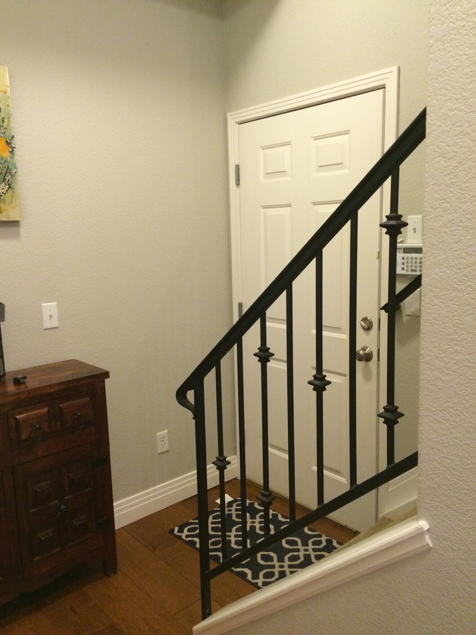 Stairs to upper level and door to attached garage - 200 Poplar St