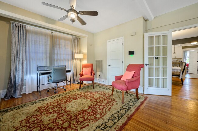 Desk and chairs in living room - 1608 Fayetteville St