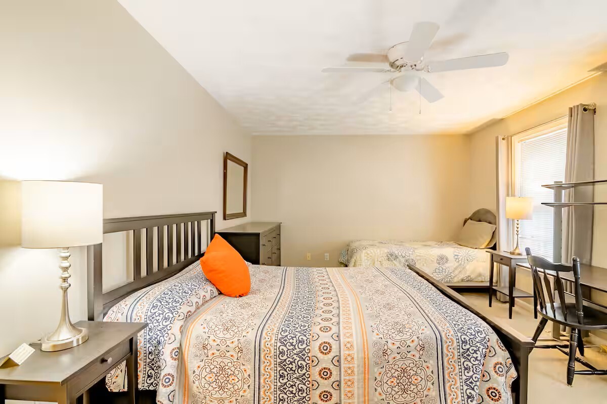 Back bedroom has queen bed with memory foam mattress and a twin bed with dresser and desk with chair - 515 School Ln