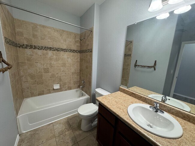 Building Photo - Move-In Ready Top-Floor Condo with New Flooring & Fresh Paint