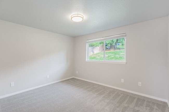 Building Photo - Recently updated 3 bdrm, 2 bath. Attached garage. Wrap around yard. Private upstairs bedroom and ...