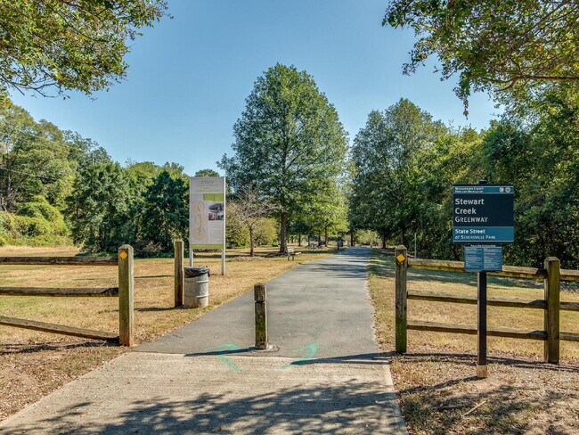 Building Photo - The Towns on Greenway! Two bedrooms. Two private baths, Half Bath. Greenway around the corner. Up...