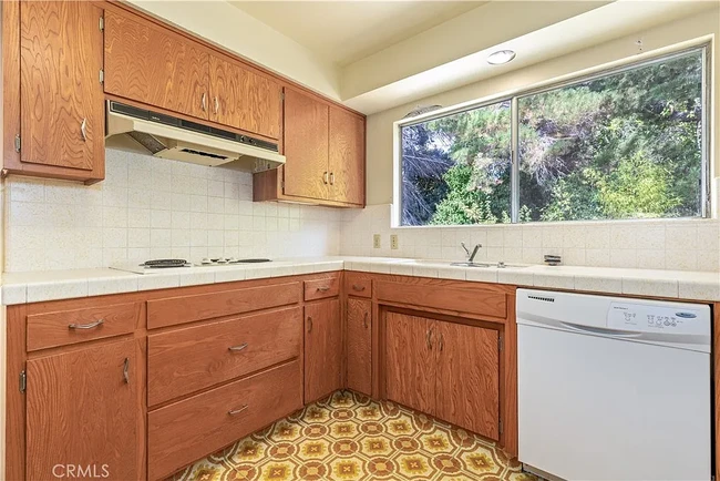 View of kitchen before new stove top, vent and diswashwer - 679 Rancho Dr