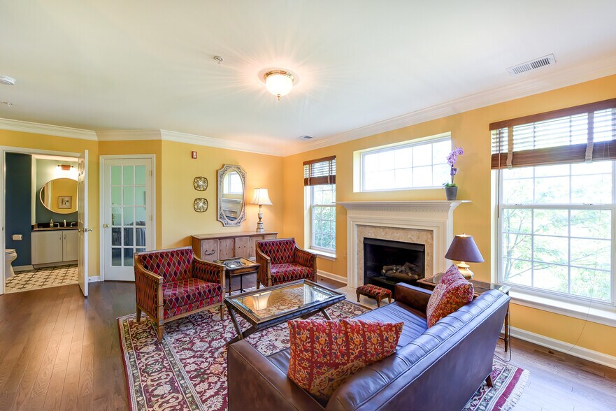 Separate den beyond living room through glass French door. - 1405 Roundhouse Lane