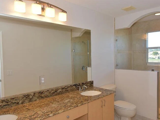 master bath with double sinks and bathroom closet - 1162 Imperial Lake Rd