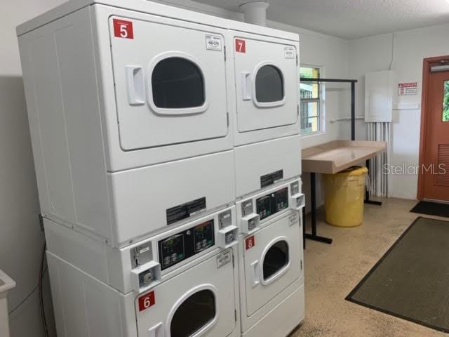 Laundry room inside clubhouse. - 320 Lakeview St