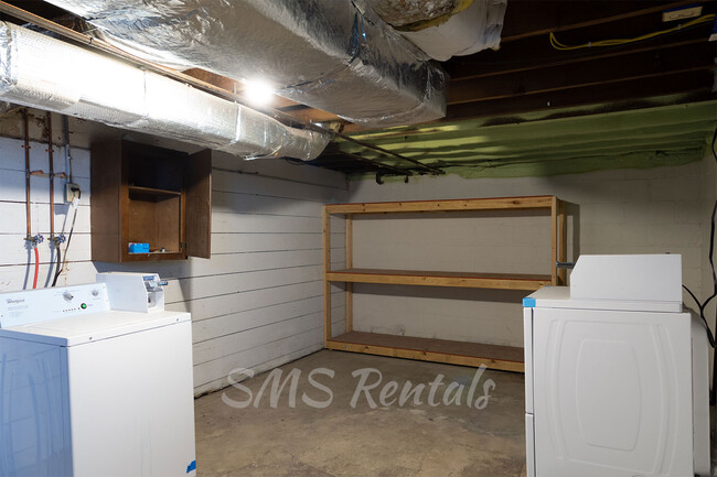 Coin Operated Laundry in Basement with Extra Storage Shelves - 319 Fink St