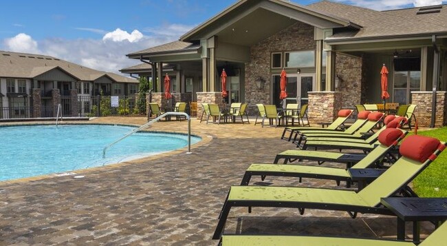 Sundeck and lounge chairs surrounding the pool - The Retreat at Fairhope Village