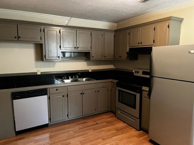 Building Photo - Camellia Cove Apartment Homes