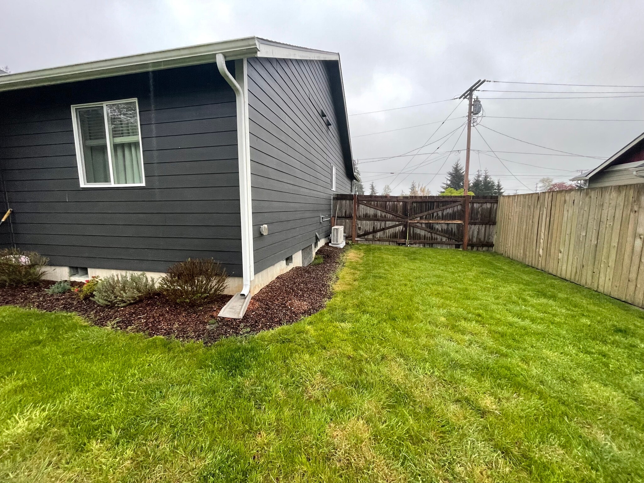 Backyard with large gate. - 627 N 3rd St